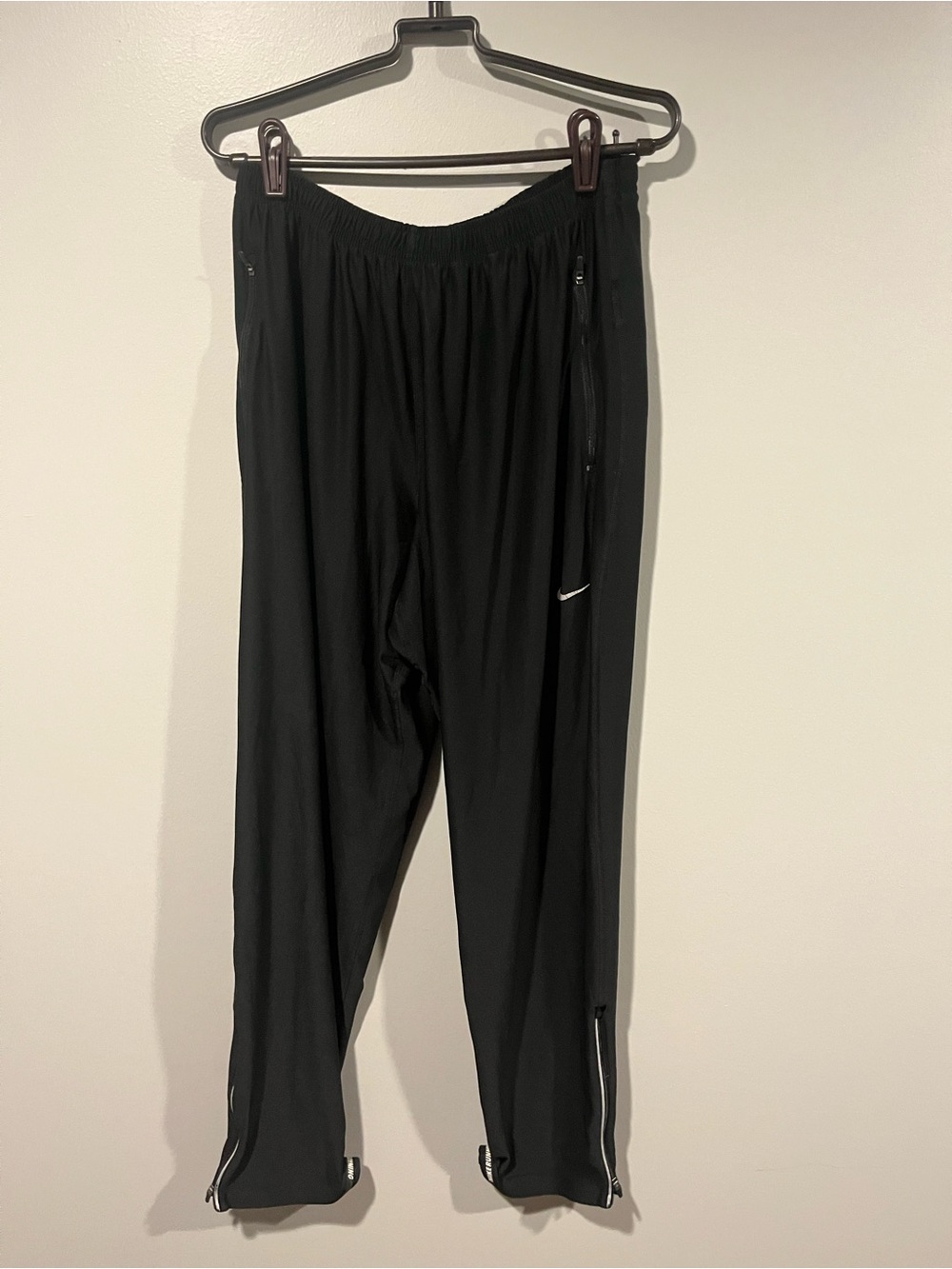 Nike Black Track Pants with White Swoosh and Ankle Zips
